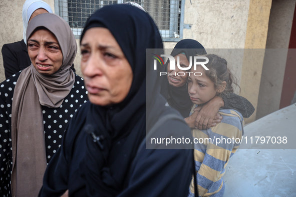 Mourners react during the funeral of Palestinians killed in an Israeli strike at Al-Aqsa Martyrs Hospital in Deir Al-Balah, in the central G...