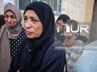 Mourners react during the funeral of Palestinians killed in an Israeli strike at Al-Aqsa Martyrs Hospital in Deir Al-Balah, in the central G...