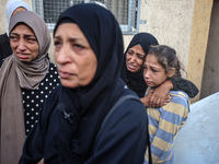 Mourners react during the funeral of Palestinians killed in an Israeli strike at Al-Aqsa Martyrs Hospital in Deir Al-Balah, in the central G...