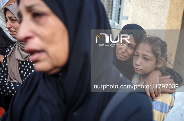 Mourners react during the funeral of Palestinians killed in an Israeli strike at Al-Aqsa Martyrs Hospital in Deir Al-Balah, in the central G...