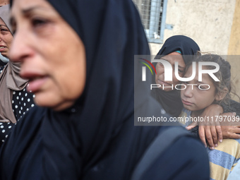 Mourners react during the funeral of Palestinians killed in an Israeli strike at Al-Aqsa Martyrs Hospital in Deir Al-Balah, in the central G...