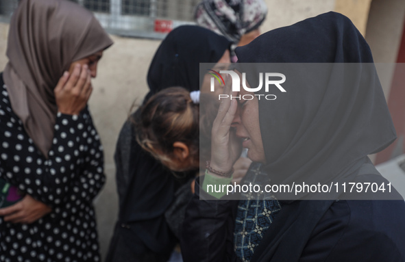 Mourners react during the funeral of Palestinians killed in an Israeli strike at Al-Aqsa Martyrs Hospital in Deir Al-Balah, in the central G...