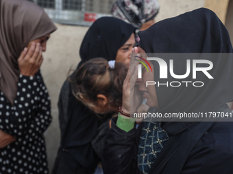 Mourners react during the funeral of Palestinians killed in an Israeli strike at Al-Aqsa Martyrs Hospital in Deir Al-Balah, in the central G...