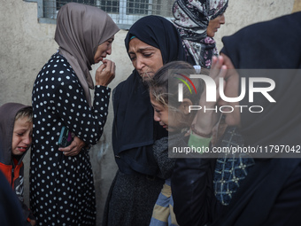 Mourners react during the funeral of Palestinians killed in an Israeli strike at Al-Aqsa Martyrs Hospital in Deir Al-Balah, in the central G...