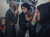 Mourners react during the funeral of Palestinians killed in an Israeli strike at Al-Aqsa Martyrs Hospital in Deir Al-Balah, in the central G...