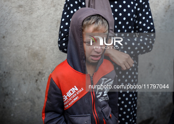 Mourners react during the funeral of Palestinians killed in an Israeli strike at Al-Aqsa Martyrs Hospital in Deir Al-Balah, in the central G...