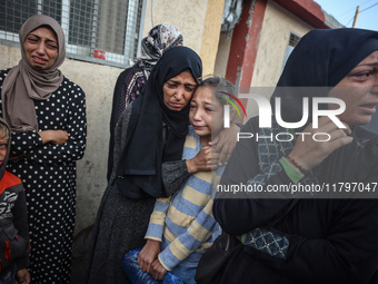 Mourners react during the funeral of Palestinians killed in an Israeli strike at Al-Aqsa Martyrs Hospital in Deir Al-Balah, in the central G...