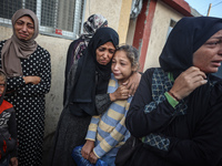 Mourners react during the funeral of Palestinians killed in an Israeli strike at Al-Aqsa Martyrs Hospital in Deir Al-Balah, in the central G...