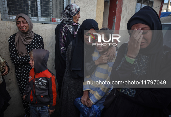 Mourners react during the funeral of Palestinians killed in an Israeli strike at Al-Aqsa Martyrs Hospital in Deir Al-Balah, in the central G...