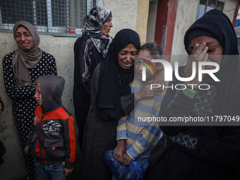 Mourners react during the funeral of Palestinians killed in an Israeli strike at Al-Aqsa Martyrs Hospital in Deir Al-Balah, in the central G...