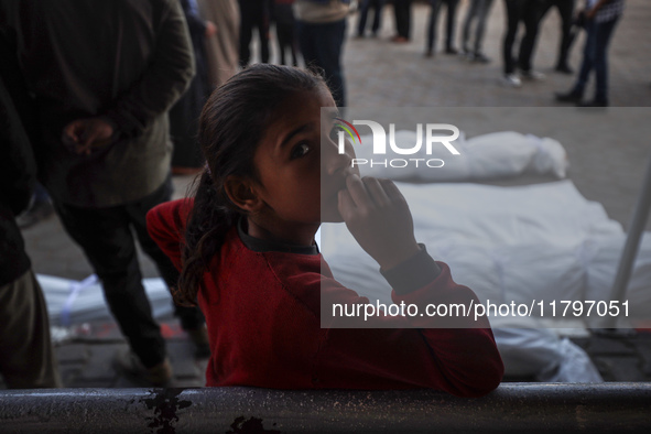 Mourners react during the funeral of Palestinians killed in an Israeli strike at Al-Aqsa Martyrs Hospital in Deir Al-Balah, in the central G...