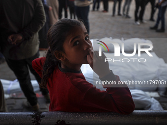 Mourners react during the funeral of Palestinians killed in an Israeli strike at Al-Aqsa Martyrs Hospital in Deir Al-Balah, in the central G...