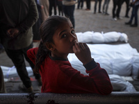 Mourners react during the funeral of Palestinians killed in an Israeli strike at Al-Aqsa Martyrs Hospital in Deir Al-Balah, in the central G...