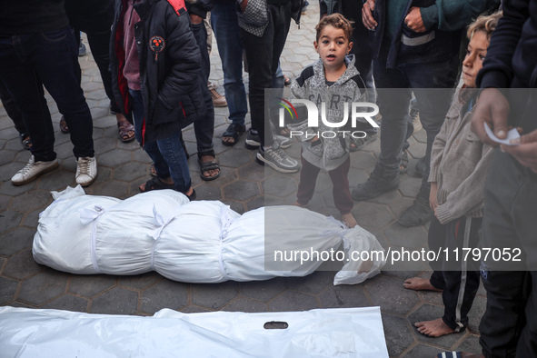 Mourners react during the funeral of Palestinians killed in an Israeli strike at Al-Aqsa Martyrs Hospital in Deir Al-Balah, in the central G...