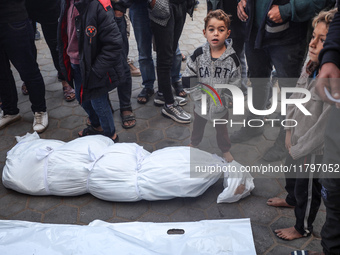 Mourners react during the funeral of Palestinians killed in an Israeli strike at Al-Aqsa Martyrs Hospital in Deir Al-Balah, in the central G...