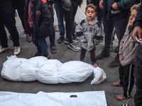 Mourners react during the funeral of Palestinians killed in an Israeli strike at Al-Aqsa Martyrs Hospital in Deir Al-Balah, in the central G...