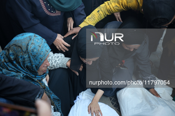 Mourners react during the funeral of Palestinians killed in an Israeli strike at Al-Aqsa Martyrs Hospital in Deir Al-Balah, in the central G...