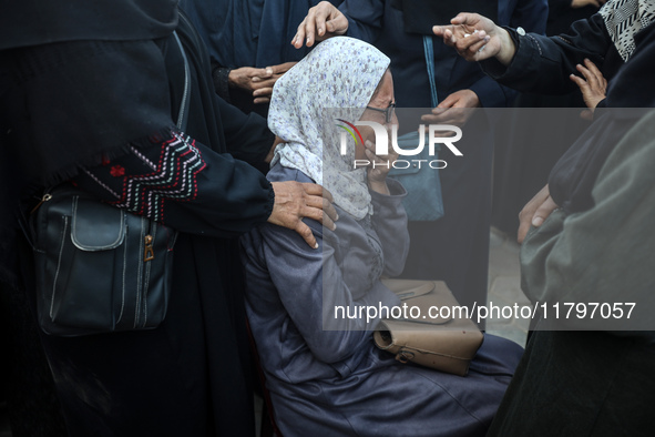 Mourners react during the funeral of Palestinians killed in an Israeli strike at Al-Aqsa Martyrs Hospital in Deir Al-Balah, in the central G...