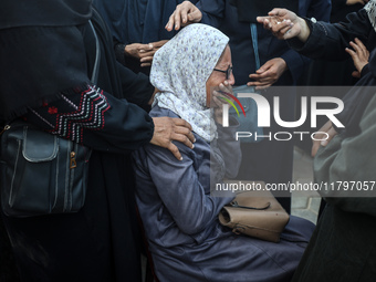 Mourners react during the funeral of Palestinians killed in an Israeli strike at Al-Aqsa Martyrs Hospital in Deir Al-Balah, in the central G...