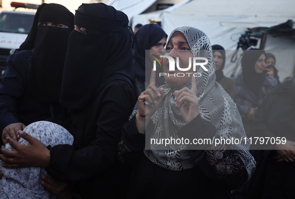 Mourners react during the funeral of Palestinians killed in an Israeli strike at Al-Aqsa Martyrs Hospital in Deir Al-Balah, in the central G...