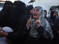 Mourners react during the funeral of Palestinians killed in an Israeli strike at Al-Aqsa Martyrs Hospital in Deir Al-Balah, in the central G...