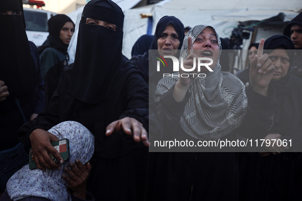 Mourners react during the funeral of Palestinians killed in an Israeli strike at Al-Aqsa Martyrs Hospital in Deir Al-Balah, in the central G...