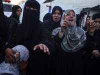 Mourners react during the funeral of Palestinians killed in an Israeli strike at Al-Aqsa Martyrs Hospital in Deir Al-Balah, in the central G...