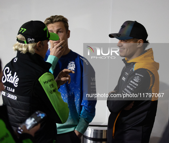 Valtteri Bottas, Liam Lawson, and Lando Norris speak before a press conference in Las Vegas, Nevada, on November 20, 2024, ahead of the Form...