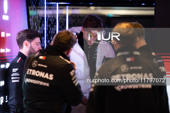 George Russell speaks to his team in the Mercedes garage paddock entrance ahead of the Formula 1 Heineken Silver Las Vegas Grand Prix in Las...