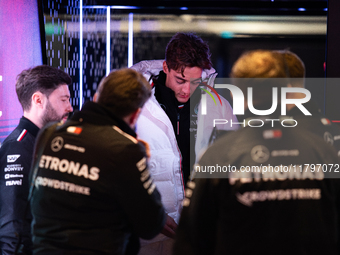 George Russell speaks to his team in the Mercedes garage paddock entrance ahead of the Formula 1 Heineken Silver Las Vegas Grand Prix in Las...