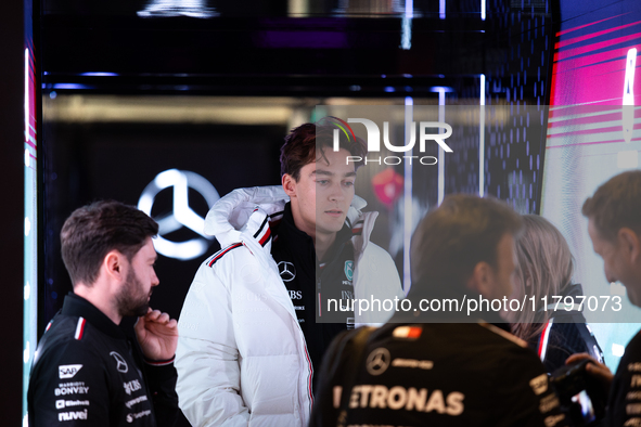 George Russell speaks to his team in the Mercedes garage paddock entrance ahead of the Formula 1 Heineken Silver Las Vegas Grand Prix in Las...