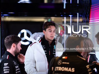 George Russell speaks to his team in the Mercedes garage paddock entrance ahead of the Formula 1 Heineken Silver Las Vegas Grand Prix in Las...