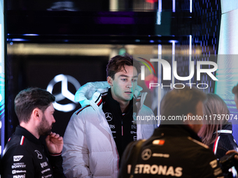 George Russell speaks to his team in the Mercedes garage paddock entrance ahead of the Formula 1 Heineken Silver Las Vegas Grand Prix in Las...