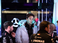 George Russell speaks to his team in the Mercedes garage paddock entrance ahead of the Formula 1 Heineken Silver Las Vegas Grand Prix in Las...