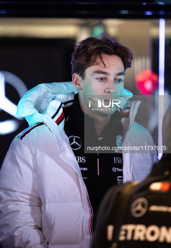 George Russell speaks to his team in the Mercedes garage paddock entrance ahead of the Formula 1 Heineken Silver Las Vegas Grand Prix in Las...