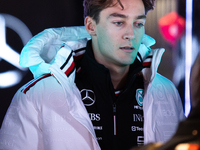 George Russell speaks to his team in the Mercedes garage paddock entrance ahead of the Formula 1 Heineken Silver Las Vegas Grand Prix in Las...