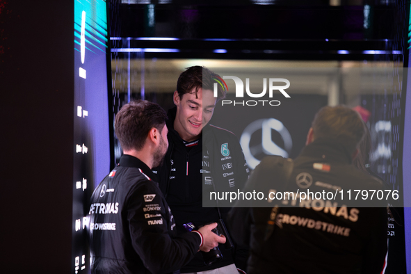 George Russell speaks to his team in the Mercedes garage paddock entrance ahead of the Formula 1 Heineken Silver Las Vegas Grand Prix in Las...