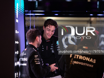 George Russell speaks to his team in the Mercedes garage paddock entrance ahead of the Formula 1 Heineken Silver Las Vegas Grand Prix in Las...