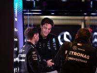 George Russell speaks to his team in the Mercedes garage paddock entrance ahead of the Formula 1 Heineken Silver Las Vegas Grand Prix in Las...