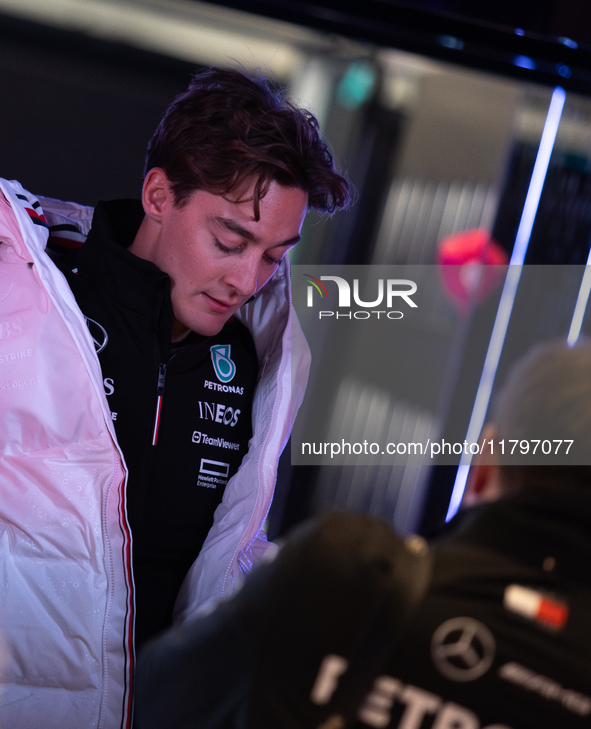 George Russell speaks to his team in the Mercedes garage paddock entrance ahead of the Formula 1 Heineken Silver Las Vegas Grand Prix in Las...