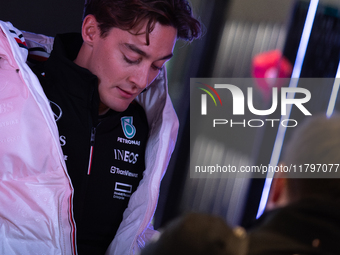 George Russell speaks to his team in the Mercedes garage paddock entrance ahead of the Formula 1 Heineken Silver Las Vegas Grand Prix in Las...