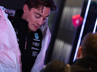 George Russell speaks to his team in the Mercedes garage paddock entrance ahead of the Formula 1 Heineken Silver Las Vegas Grand Prix in Las...