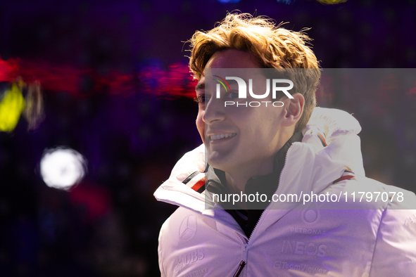 George Russell speaks to his team in the Mercedes garage paddock entrance ahead of the Formula 1 Heineken Silver Las Vegas Grand Prix in Las...