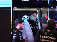 George Russell speaks to his team in the Mercedes garage paddock entrance ahead of the Formula 1 Heineken Silver Las Vegas Grand Prix in Las...