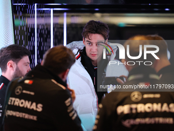 George Russell speaks to his team in the Mercedes garage paddock entrance ahead of the Formula 1 Heineken Silver Las Vegas Grand Prix in Las...