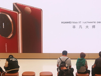 Huawei's first triple foldable screen phone, the Mate XT, is displayed at Huawei's global flagship store in Shanghai, China, on October 15,...