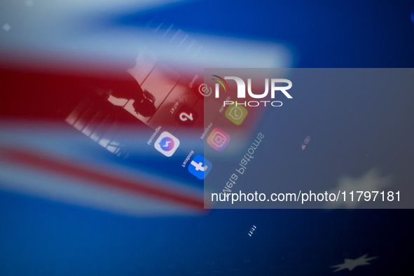 Social network logos display on a smartphone screen and the Australian flag appears on a computer screen in this photo illustration in Athen...