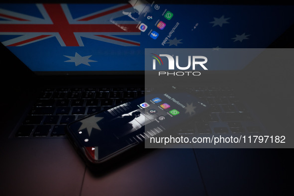 Social network logos display on a smartphone screen and the Australian flag appears on a computer screen in this photo illustration in Athen...