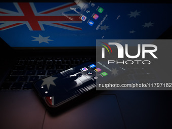 Social network logos display on a smartphone screen and the Australian flag appears on a computer screen in this photo illustration in Athen...