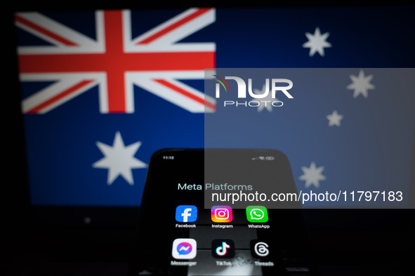 Social network logos display on a smartphone screen and the Australian flag appears on a computer screen in this photo illustration in Athen...